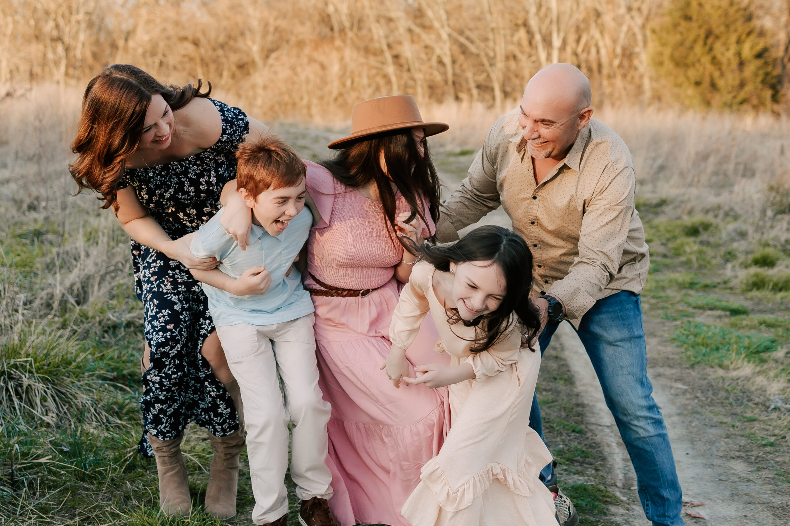 a Family of 5 chasing each other and having fun with the top 5 things to do in St. Louis with kids