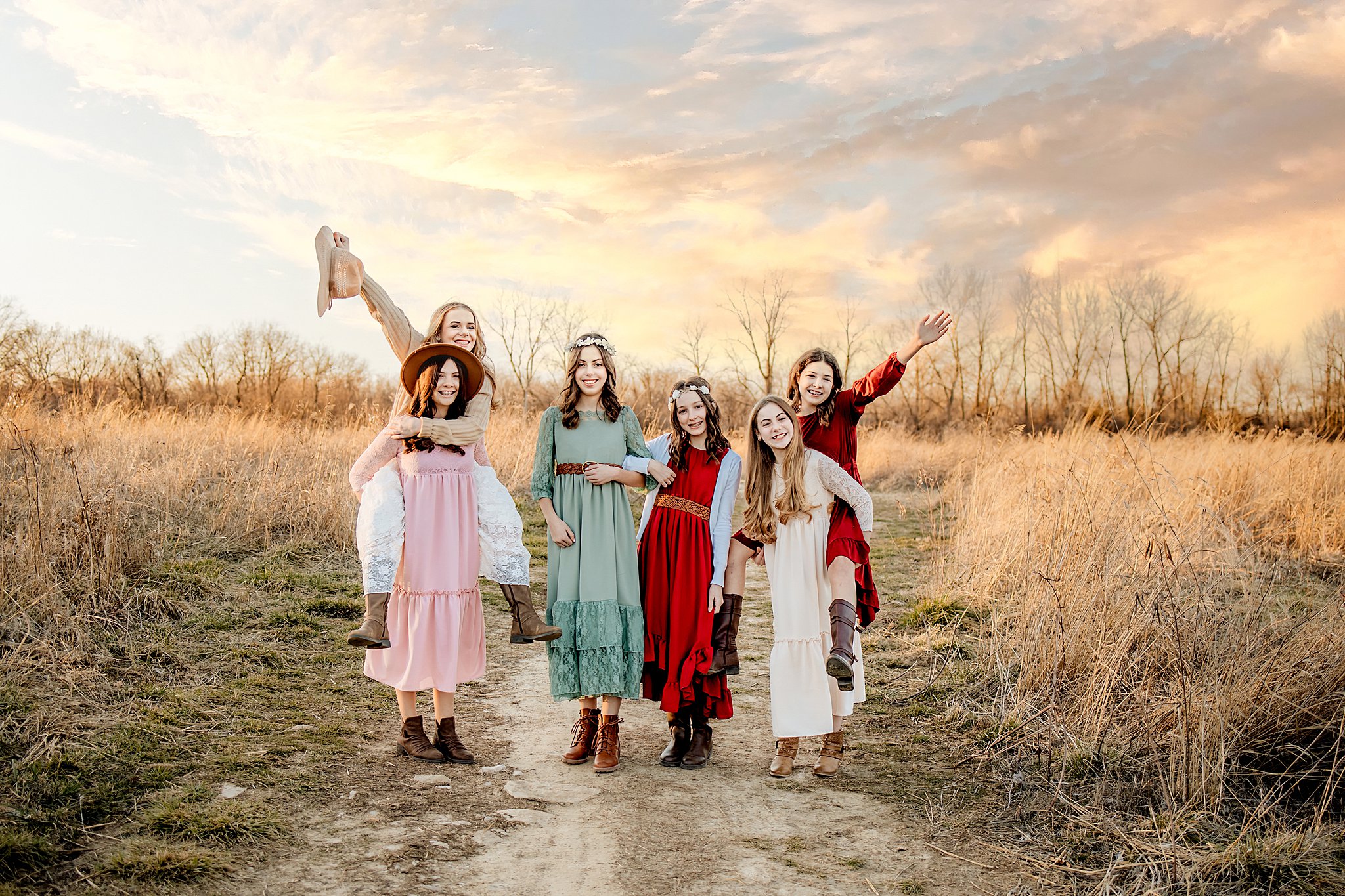 Six preteens play in a field of golden grass oakville pediatricians